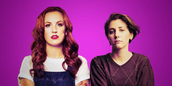 Gigless-image-3000px Two white women look ahead at the camera, against a purple background.
